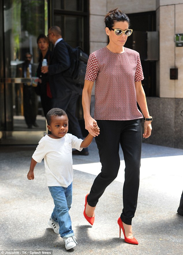 'A little dictator': Sandra Bullock, pictured last week in NYC, says her son Louis has shifted her priorities '1000 percent' in a new interview with German's Bild newspaper 